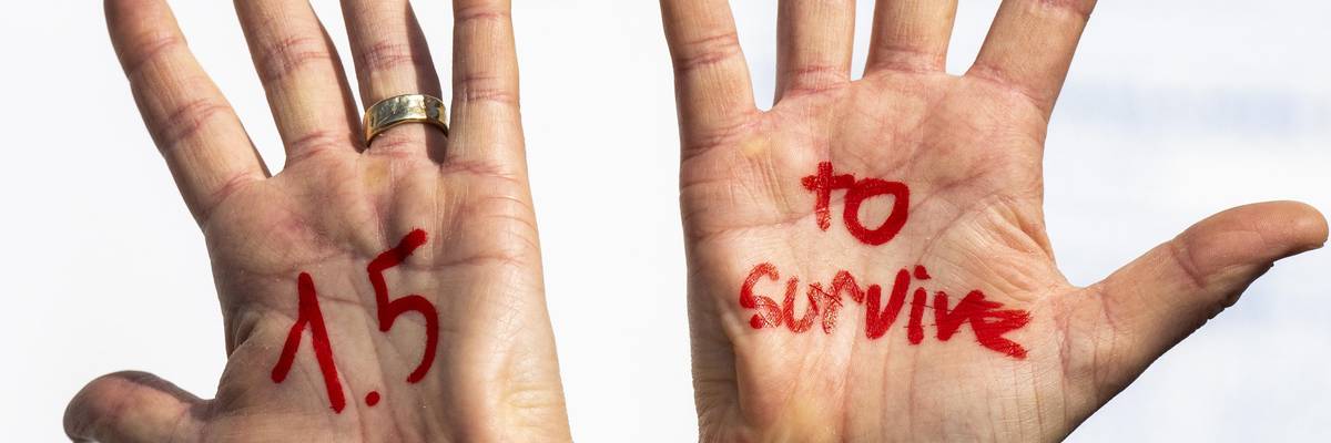 "1.5 to survive" message at protest