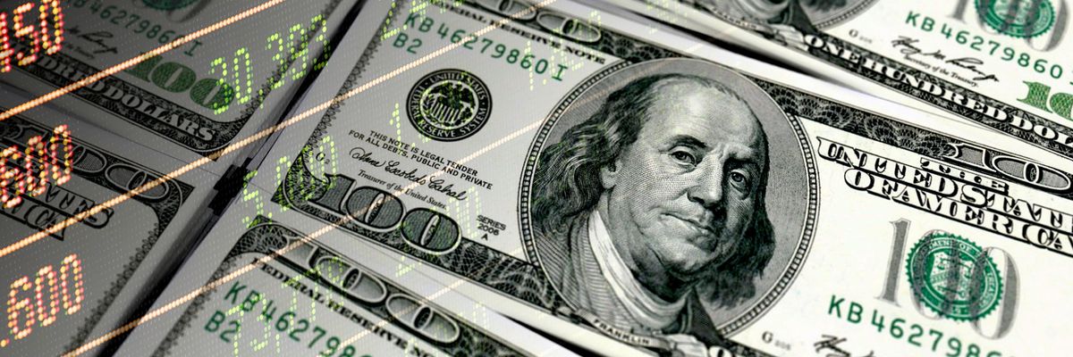 $100 bills overlaid with stock market figures