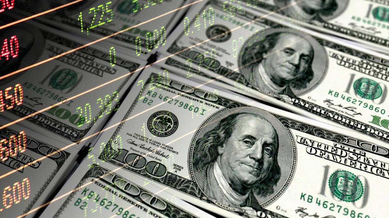 $100 bills overlaid with stock market figures