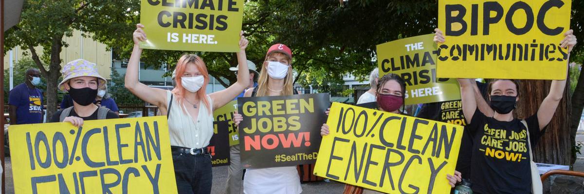 100% clean energy signs