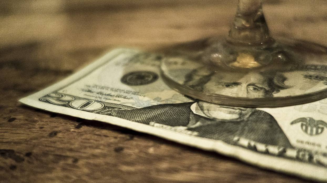 20 Dollar bill under a glass