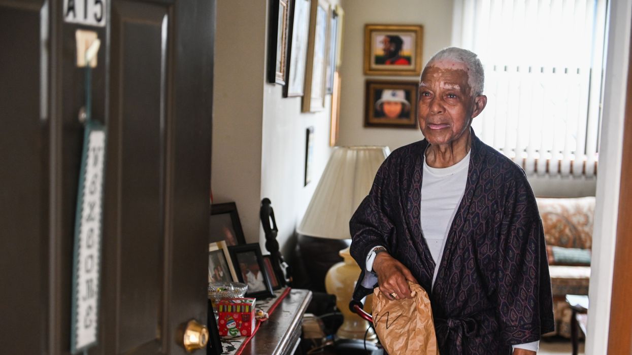 94-year-old Edward Bates receives a meal delivery from the Wyandanch Nutritional Center in Wyandanch, New York on March 17, 2020.