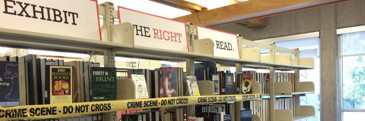 A Banned Books Week display with books under yellow crime scene tape. 