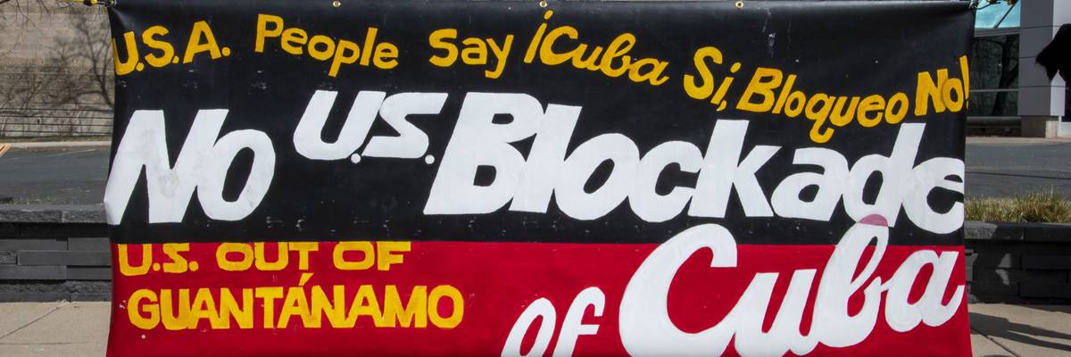 A banner argues against the US blockade on Cuba.