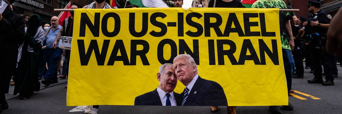 A banner reads, "No US-Israel war on Iran" with a photo of Netanyahu speaking into Trump's ear.