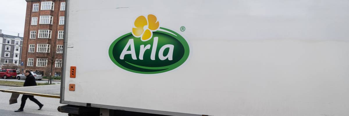 a big truck has an arla logo on it