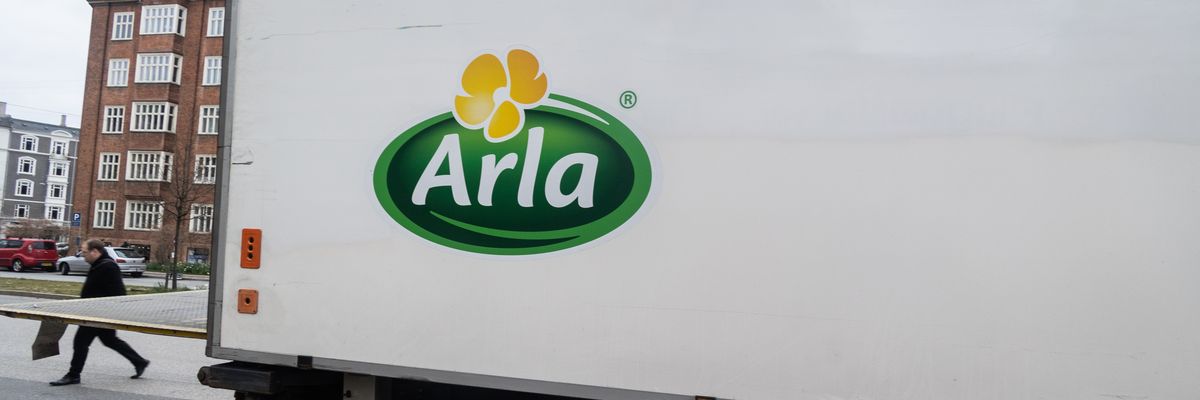 a big truck has an arla logo on it