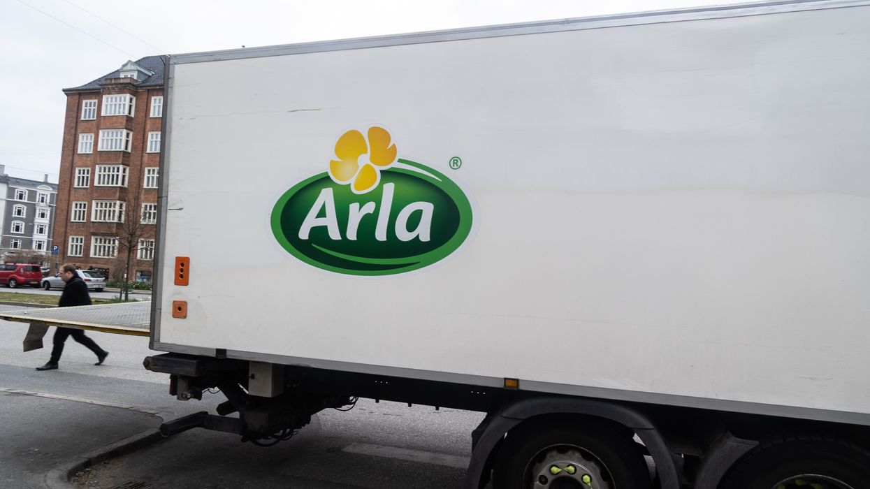 a big truck has an arla logo on it