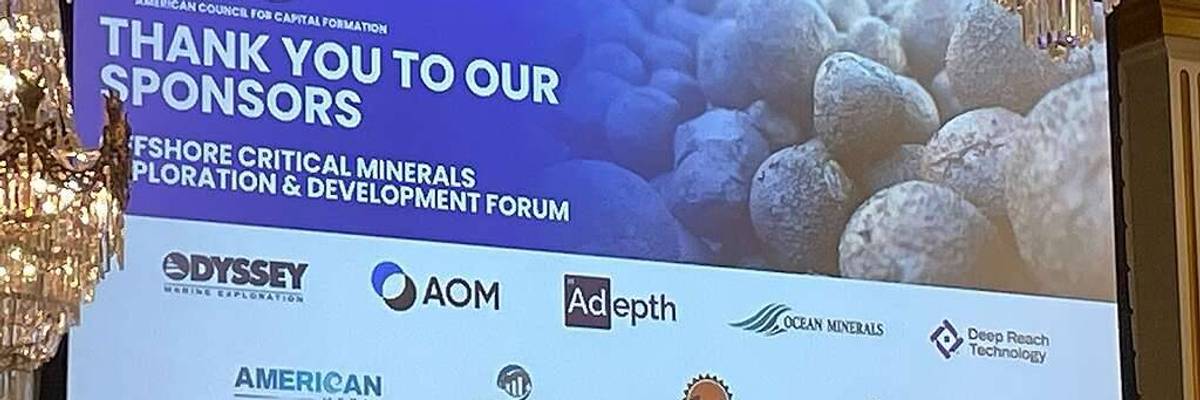 A billboard advertises the Offshore Critical Minerals Exploration and Development Forum.