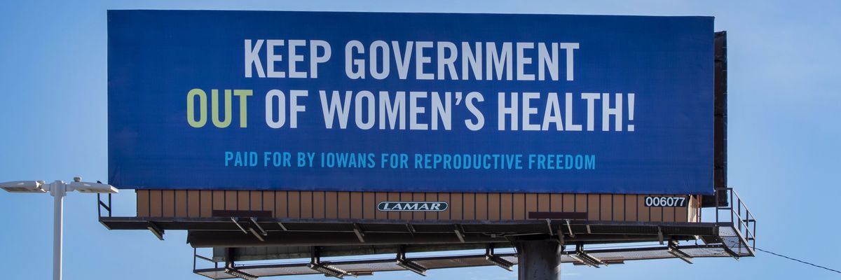 A billboard calls to keep government out of women's health