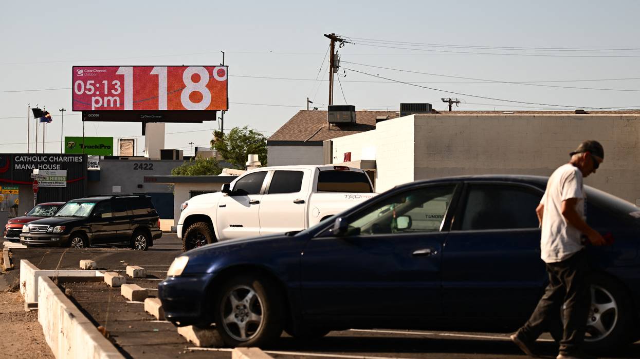 A billboard displays a temperature of 118°F