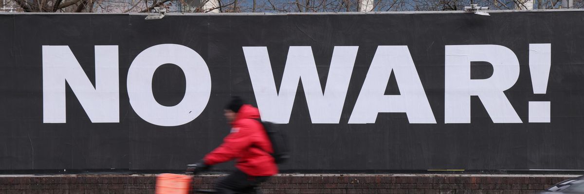 A billboard hanging outside a night club reads: "No War!" on January 18, 2022 in Berlin, Germany.