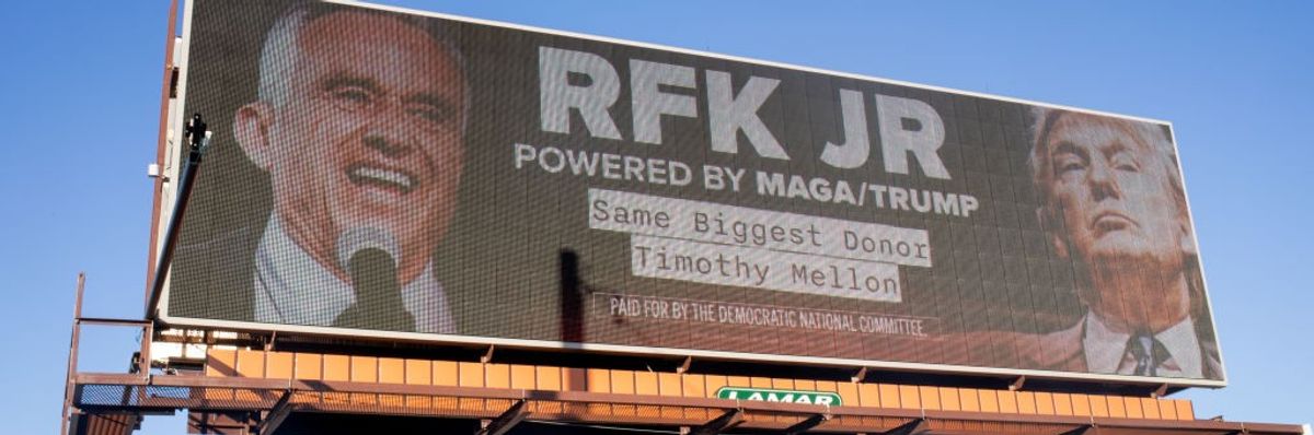 A billboard reading: "RFK Jr, Powered by MAGA/Trump"