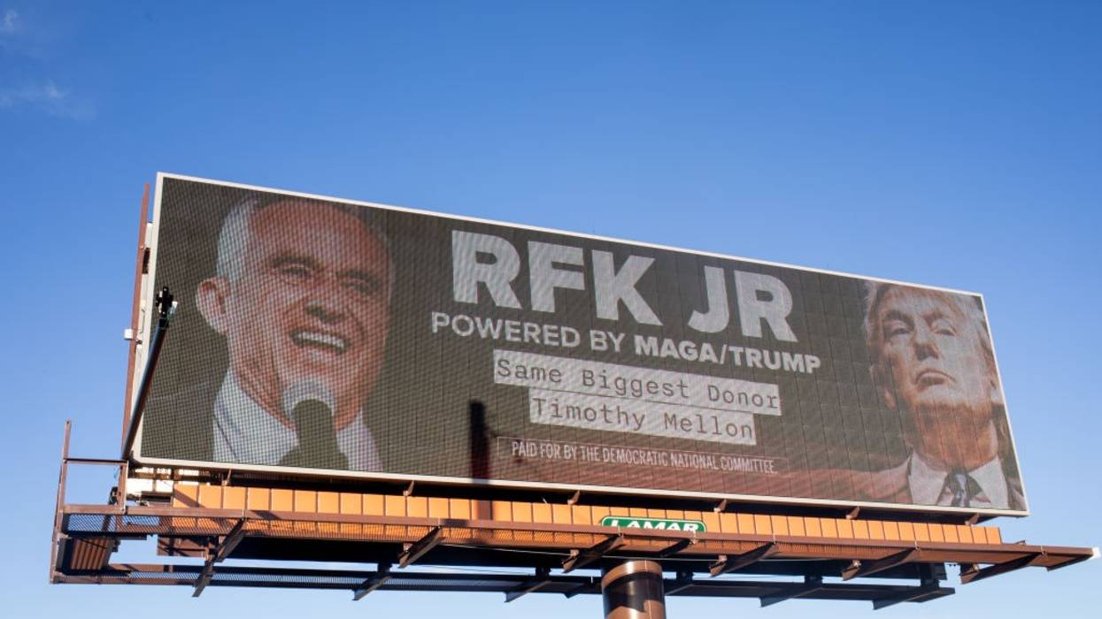 A billboard reading: "RFK Jr, Powered by MAGA/Trump"
