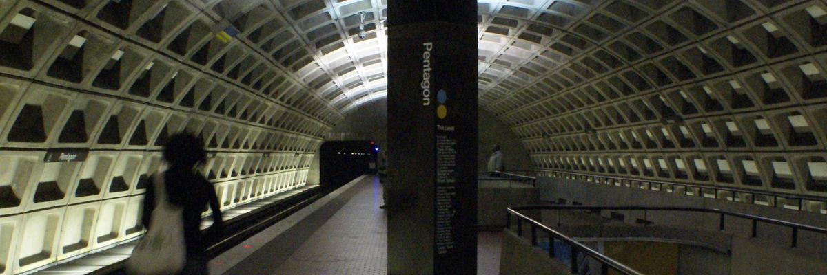 A blurred commuter walks through the D.C. Metro Pentagon station. 