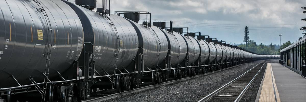A BNSF freight train hauling tankers loaded with crude oil heads west through a transcontinental railroad hub on June 22, 2018 in Whitefish, Montana, home to Glacier National Park.
