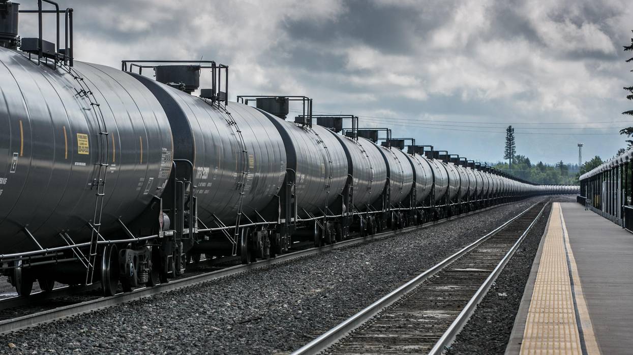 A BNSF freight train hauling tankers loaded with crude oil heads west through a transcontinental railroad hub on June 22, 2018 in Whitefish, Montana, home to Glacier National Park.