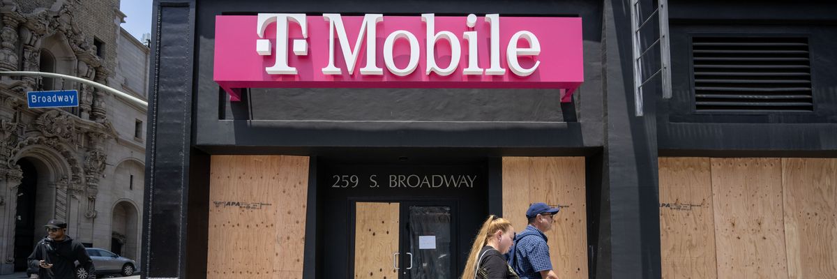A boarded-up T-Mobile store.