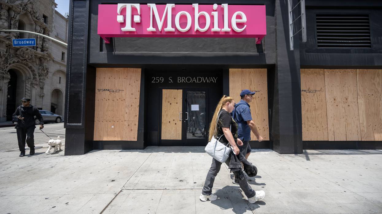 A boarded-up T-Mobile store.
