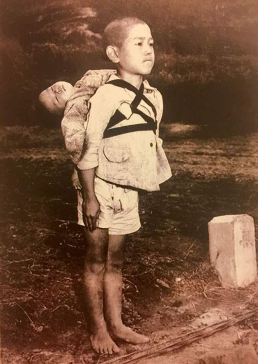 A boy carries his dead brother on his shoulders while he waits at a cemetery in Nagasaki in an image taken by U.S. Marine Joe O'Donnell in 1945.
