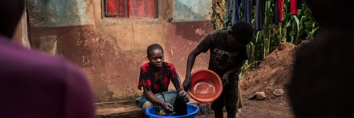 A boy fetches water from his family's well