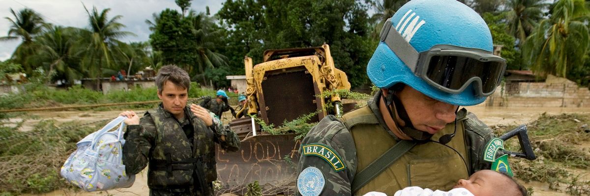 A Brazilian peacekeeper serving with the United Nations Stabilization Mission in Haiti (MINUSTAH) rescues a child from his flooded home in the Cite Soleil neighborhood of the Haitian capital of Port-au-Prince.