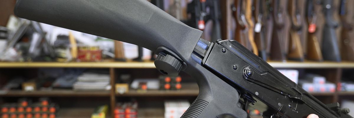 A bump stock device that fits on a semi-automatic rifle to increase the firing speed