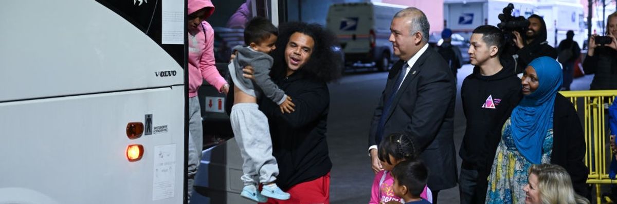 A bus carrying migrants from Texas arrives in NYC