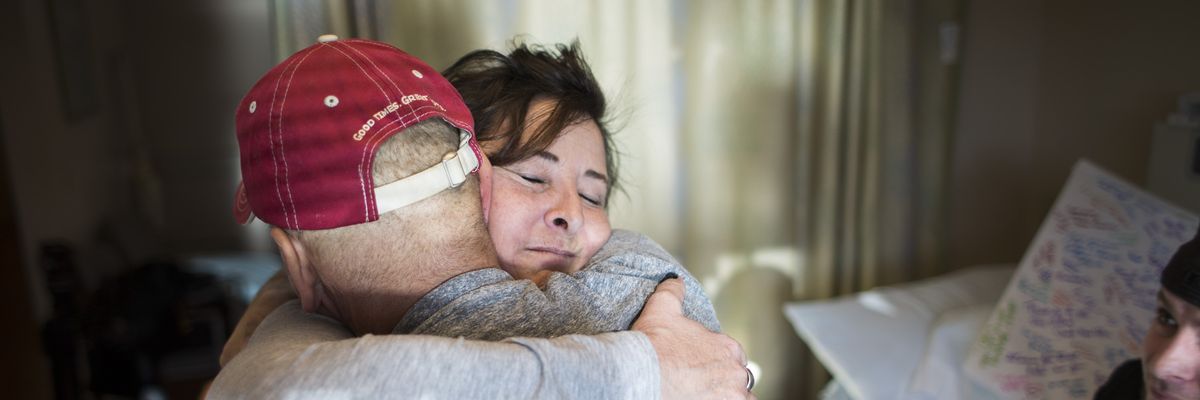 A cancer patient hugs his wife Mercy Fore River Campus in Portland, Maine