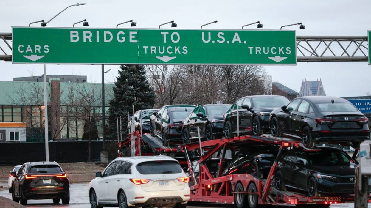 A car hauler heads to cross the Ambassador Bridge
