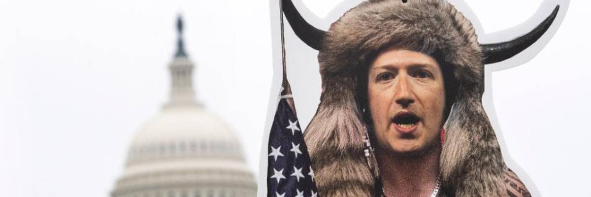 A cardboard cutout of Mark Zuckerberg, CEO of Facebook, dressed up as the QAnon Shaman