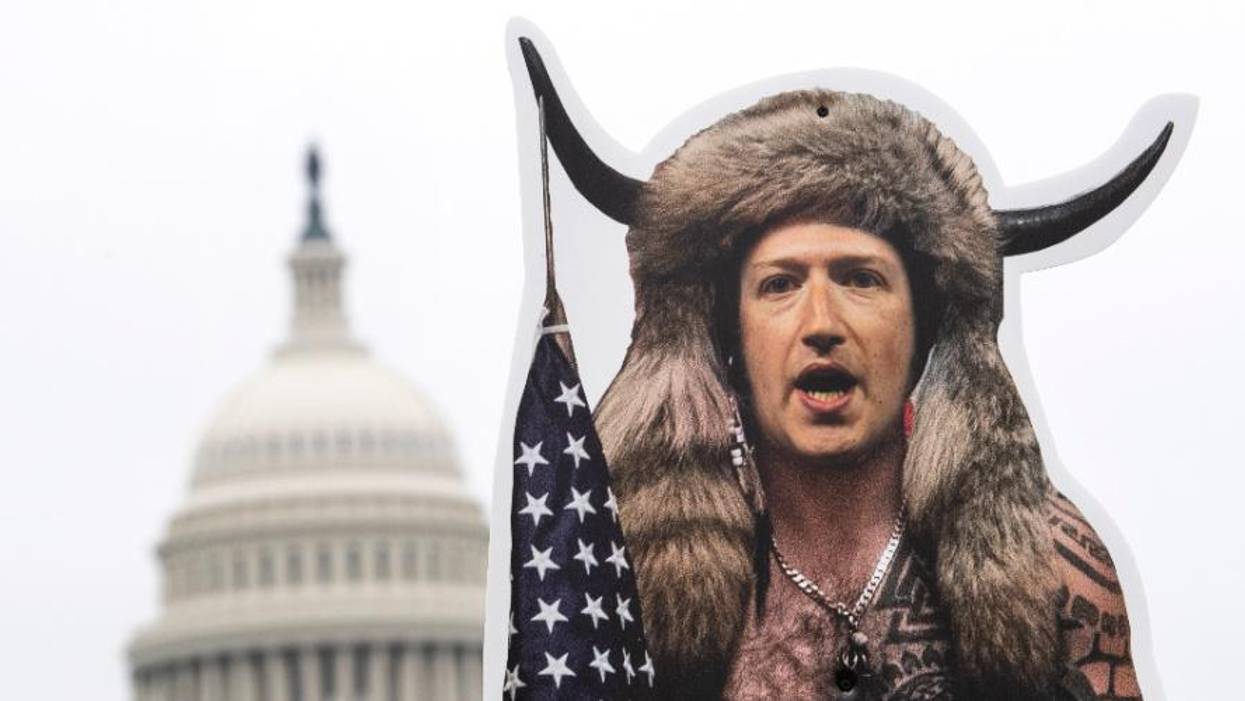 A cardboard cutout of Mark Zuckerberg, CEO of Facebook, dressed up as the QAnon Shaman