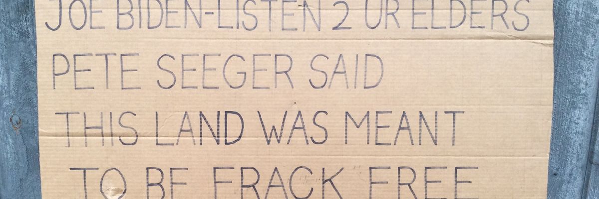 A cardboard protest sign.