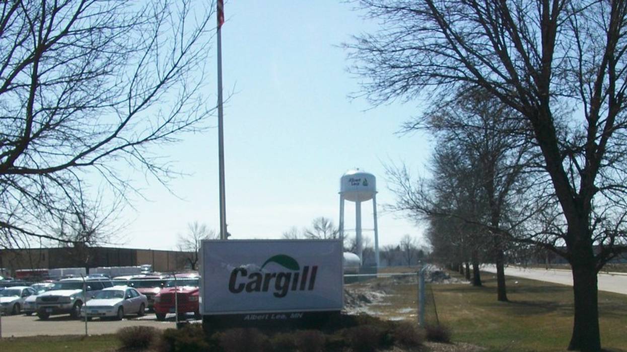 A Cargill billboard is shown in front of a parking lot.