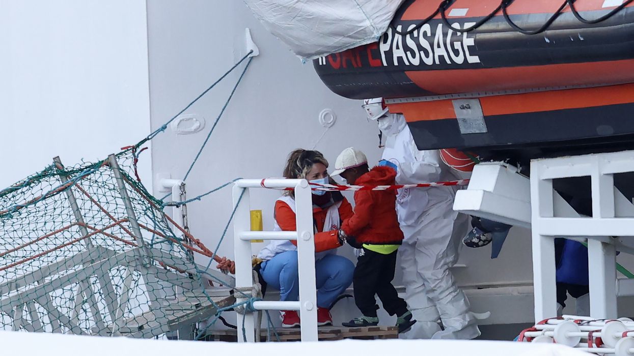 A child disembarks from the Medecins sans Frontieres (Doctors Without Borders) Geo Barents ship