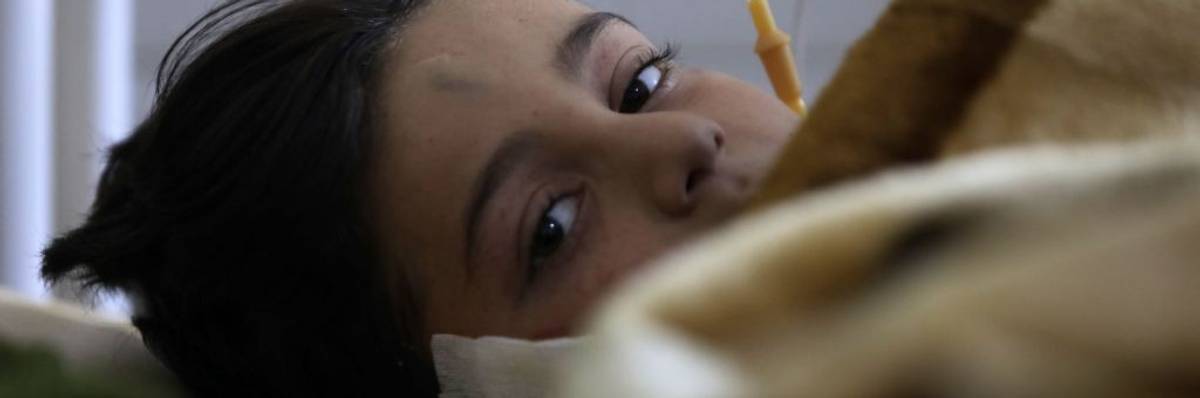 A child injured in a deadly earthquake lies in a bed at a hospital in Afrin in Syria's rebel-held part of Aleppo province, on February 9, 2023.