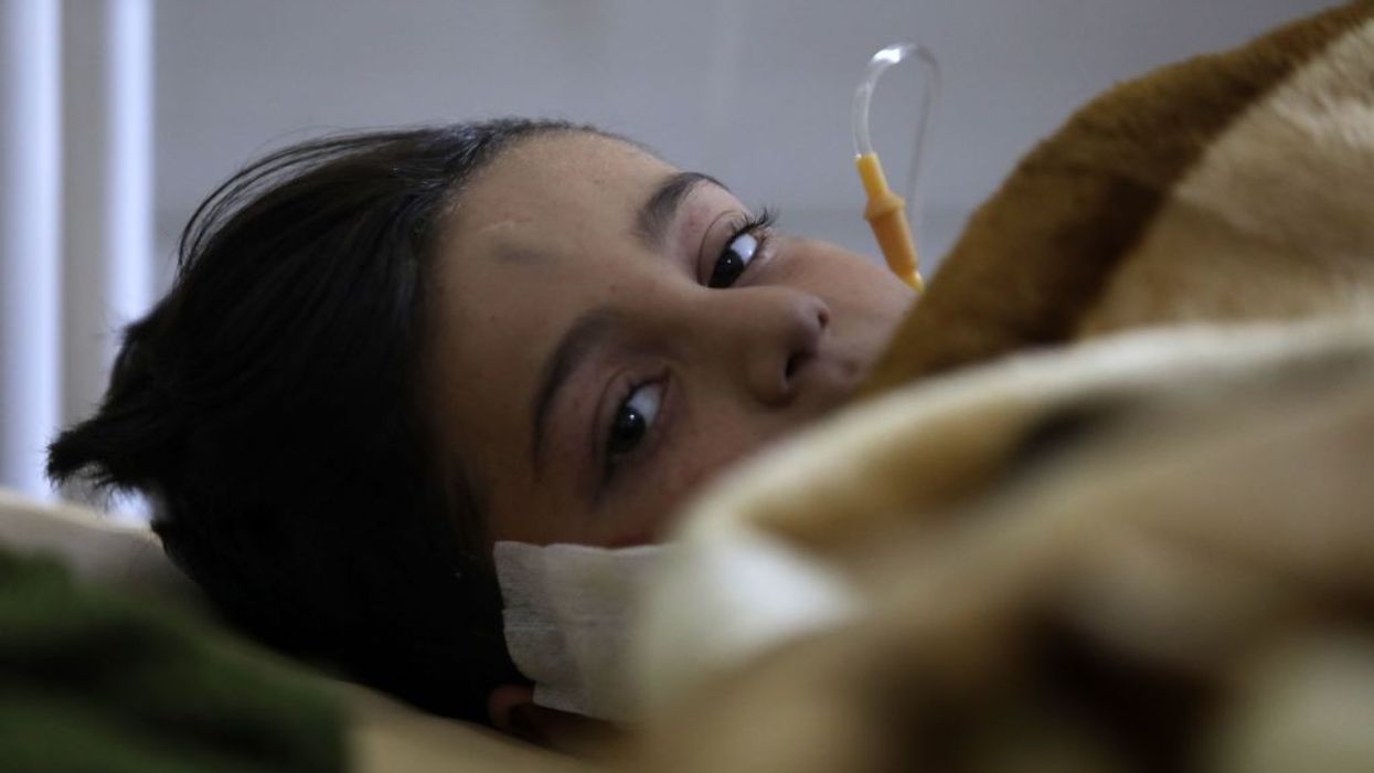 A child injured in a deadly earthquake lies in a bed at a hospital in Afrin in Syria's rebel-held part of Aleppo province, on February 9, 2023.