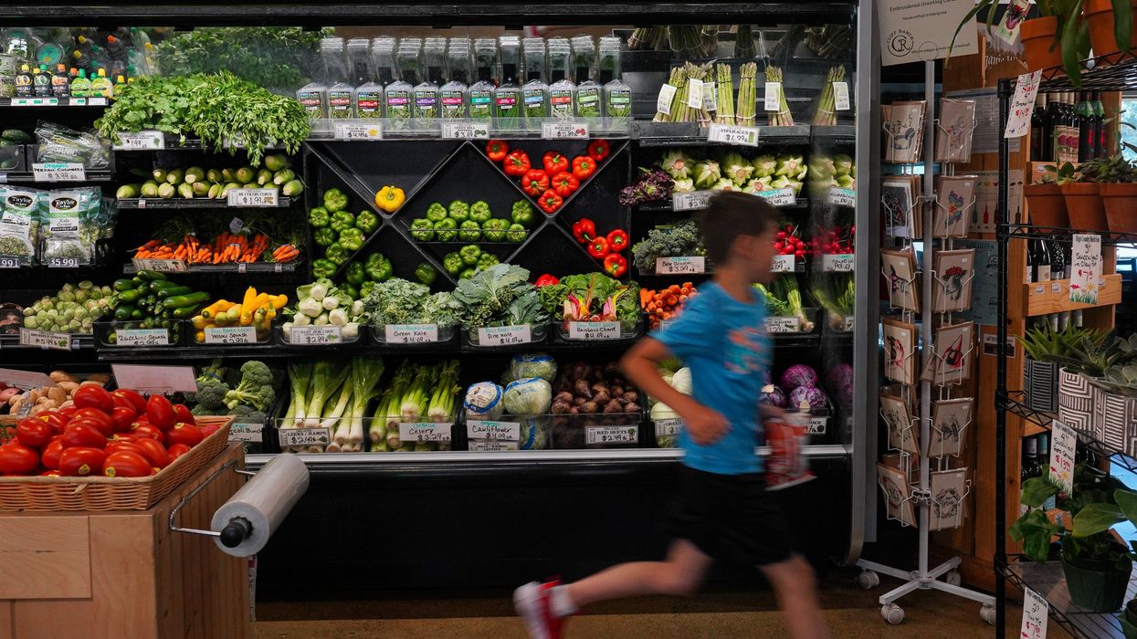 A child runs through the produce aisle