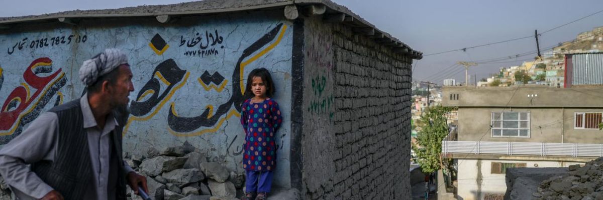 A child stands in a street in Afghanistan