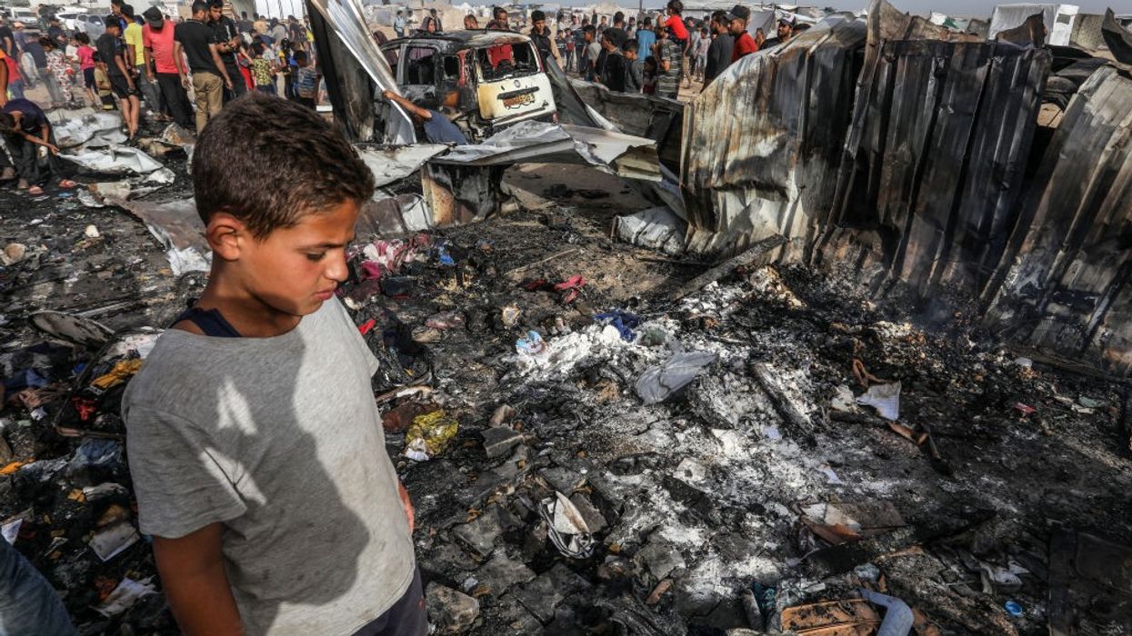 A child surveys rubble in Rafah.