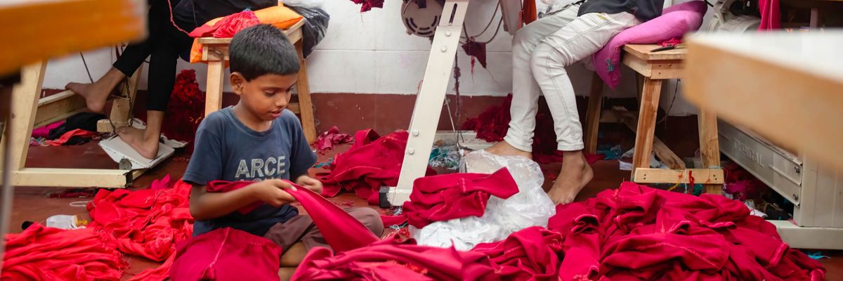 A child works at a garment factory