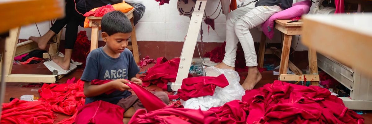 A child works at a garment factory