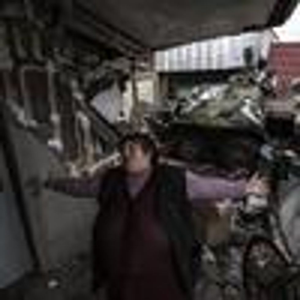 A civilian reacts after Ukrainian soldiers took back Chernihiv region from Russian forces on April 2, 2022. (Photo: Metin Aktas/Anadolu Agency via Getty Images)