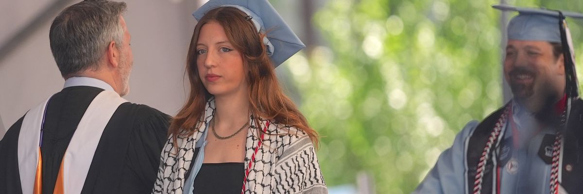 A Columbia University graduate wears a keffiyeh during a commencement ceremony