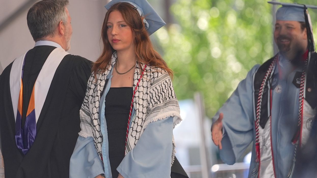 A Columbia University graduate wears a keffiyeh during a commencement ceremony