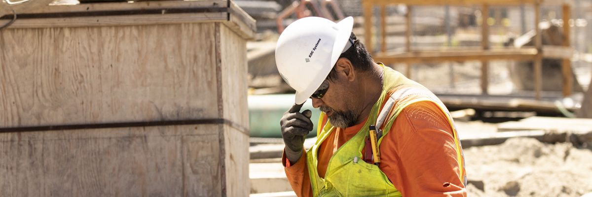 A construction worker in high heat.