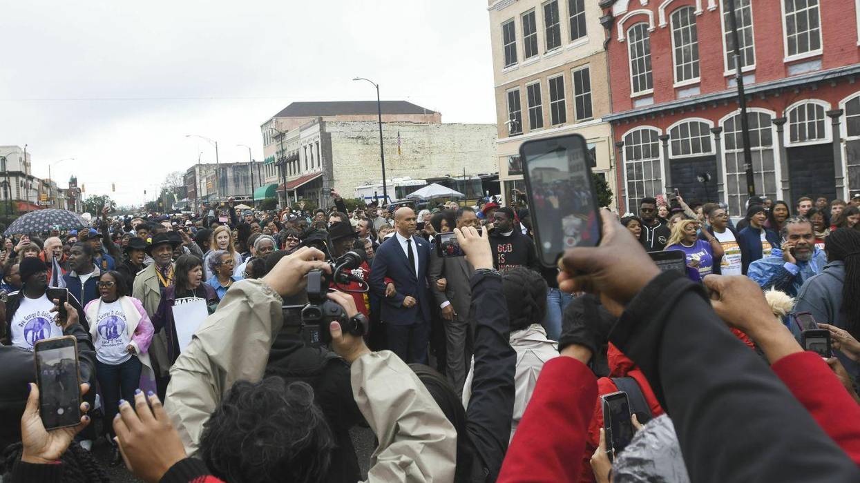 A crowd forms to take photos of the marchers before they cross the Edmund Pettus Bridge Sunday, March 3, 2019, during the Bloody Sunday commemoration in Selma, Ala.