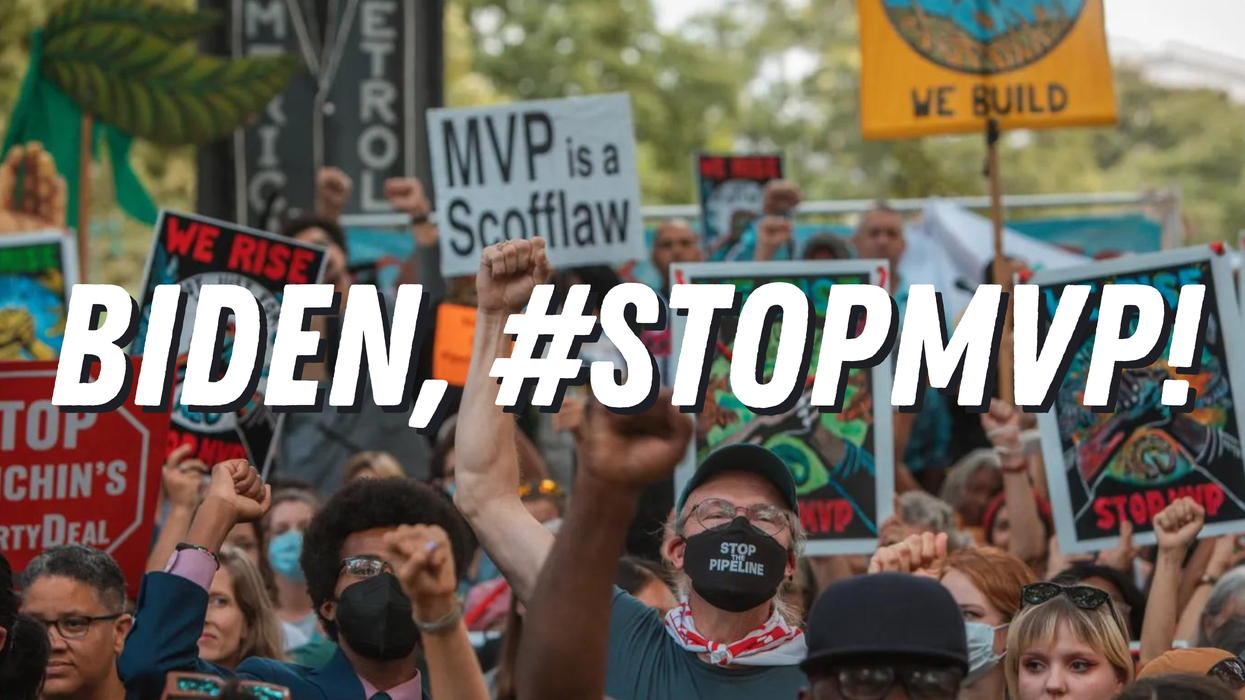 A crowd marches behind the words, “BIDEN, #STOPMVP!” in white.