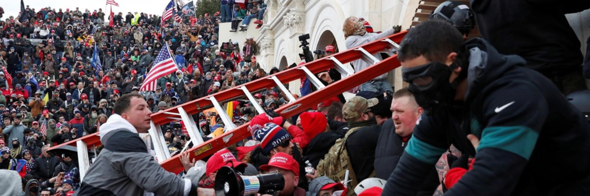 A crowd storms the U.S. Capitol with a red ladder.