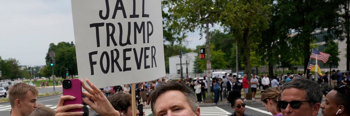 A crowd urges "Jail Trump Forever" last month outside D.C. courthouse where he was arraigned for trying to overturn the results of the 2020 electionin